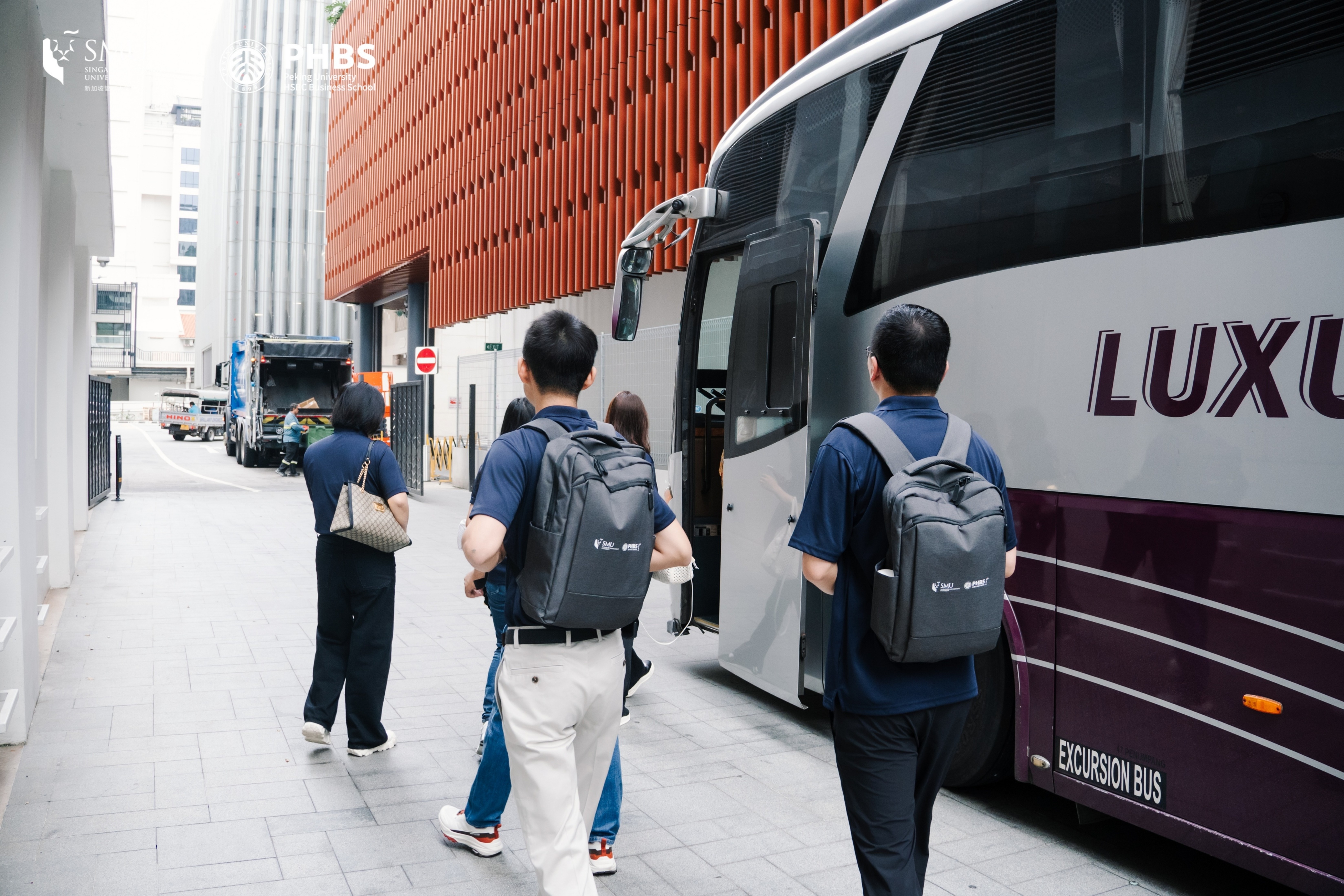 students going up the bus